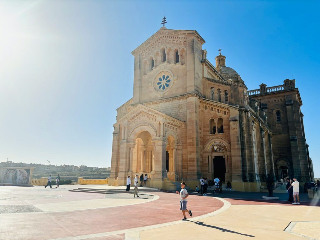 a person standing in front of a large building